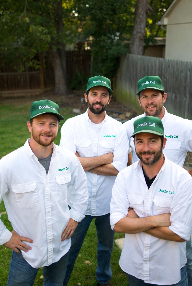 The Doodie Call team in branded hats and shirts